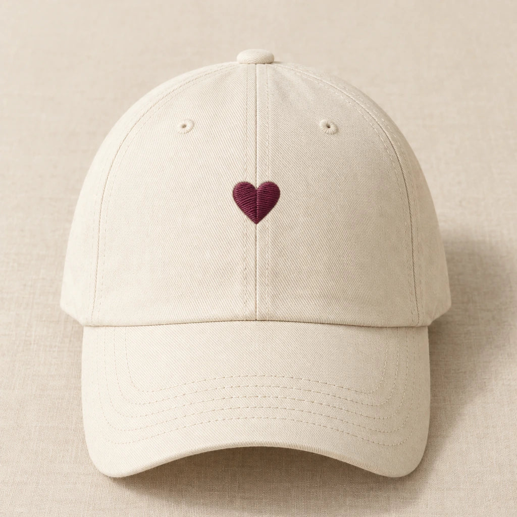 Matching concept mockup with a small wine-coloured embroidered heart on the cap